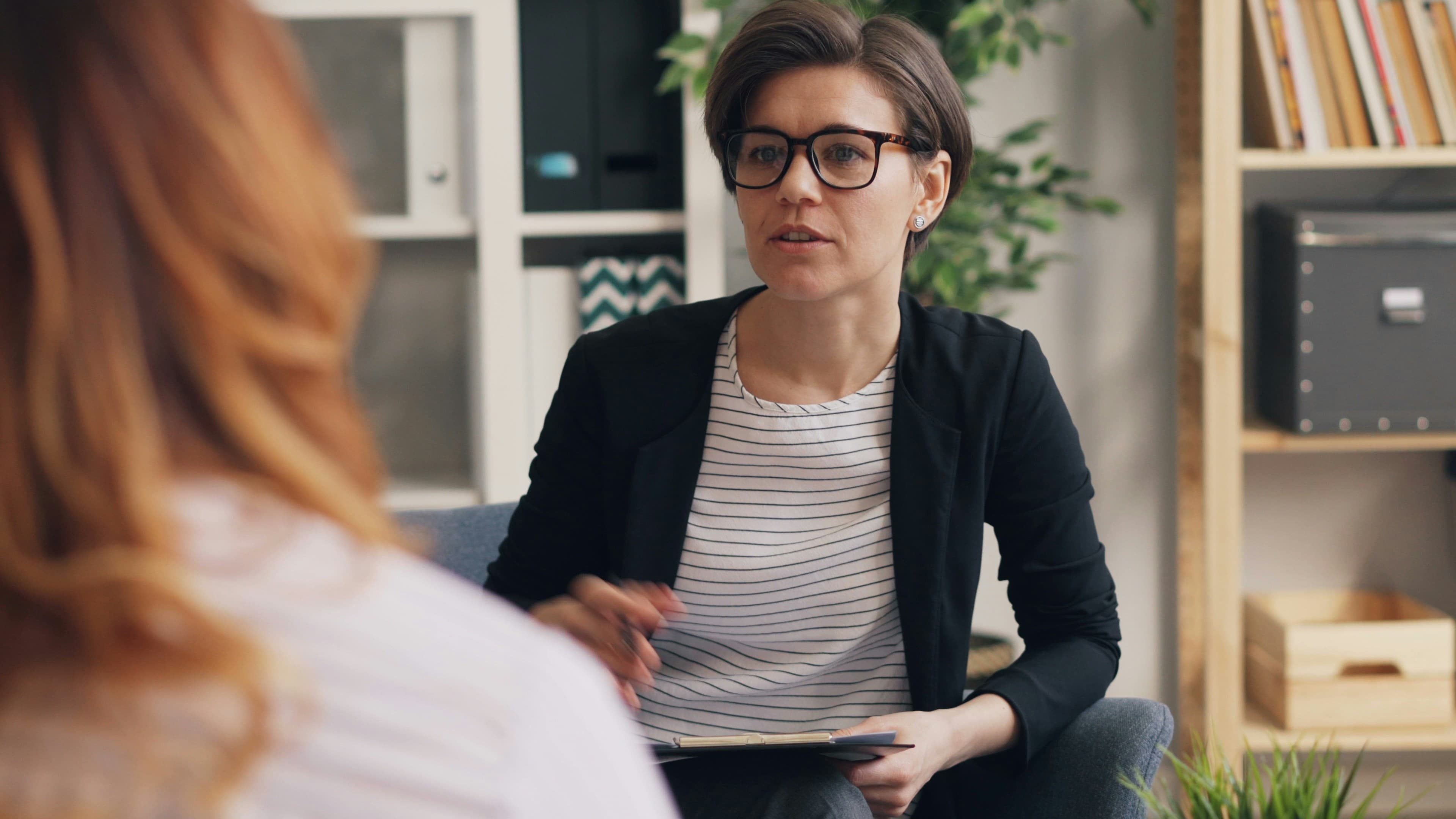 Therapy session between a psychotherapist and client